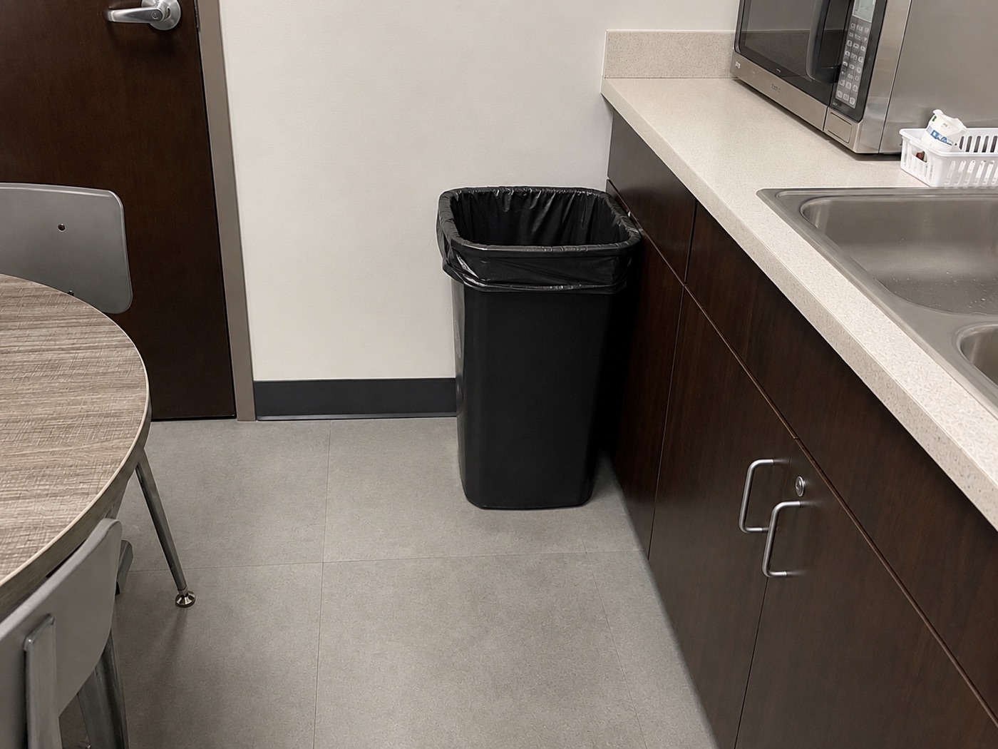 Resolved - emptied, area cleaned