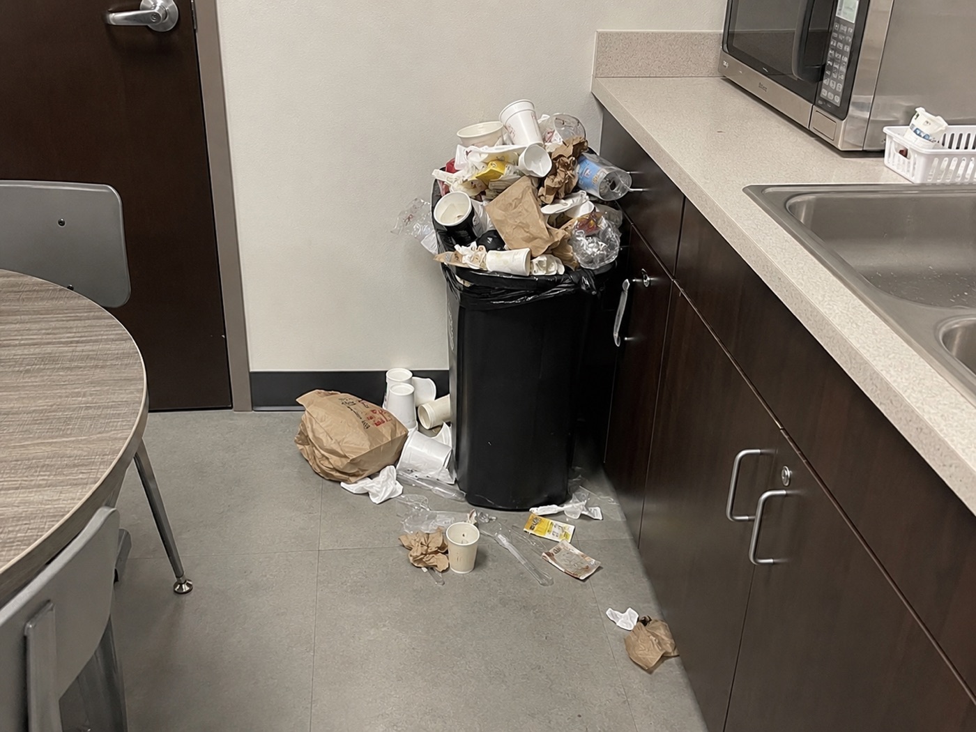 Reported - overflowing trash, debris on floor